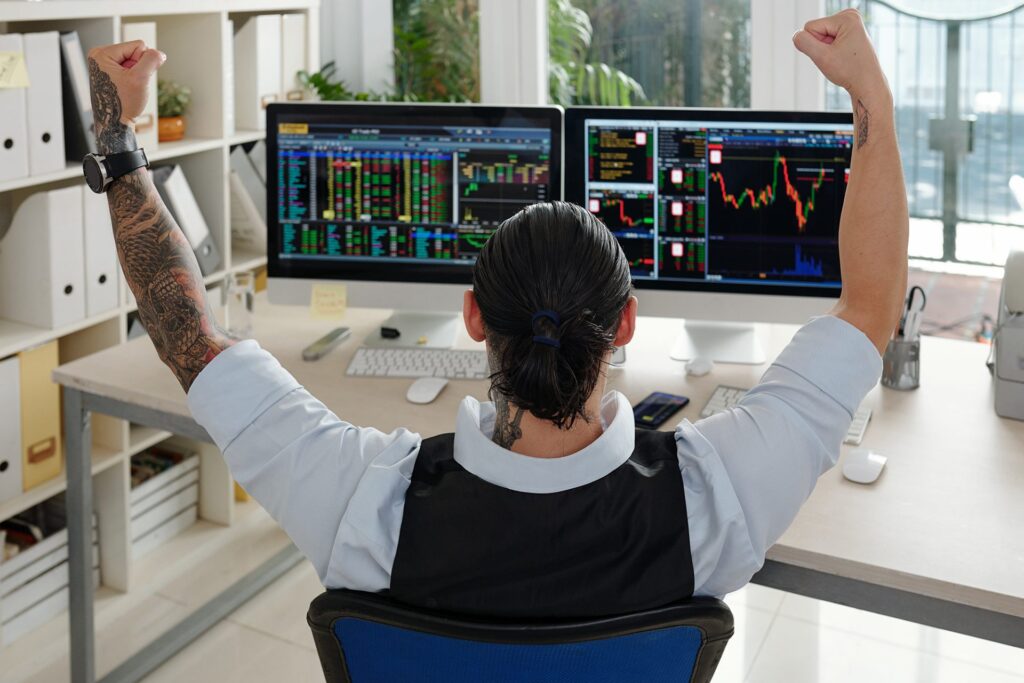 Excited stock trader celebrating gains
